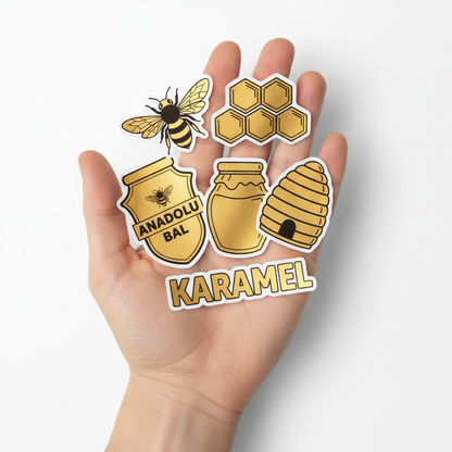 Elde tam kesim altın metalize sticker çeşitleri — arı, petek ve yazı formunda kesim